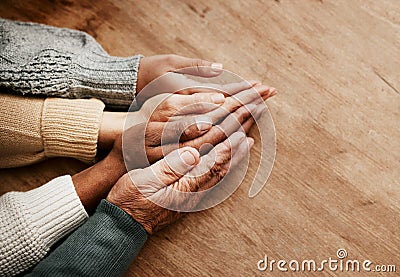 People, hands together and generations in support above on mockup for unity, compassion or trust on wooden table. Group Stock Photo