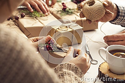 People hands wrap gift boxes Stock Photo