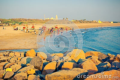 People have a rest on ocean shore in Somnath Editorial Stock Photo