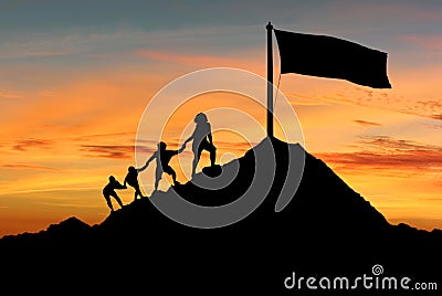 People helping each other to reach top of the mounting Stock Photo