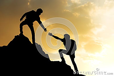 People helping on peak mountain and sunrise background climbing Stock Photo