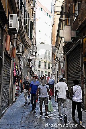 People on Historic Narrow Pedestrian Street Via San Luca, Genoa, Italy. Editorial Stock Photo