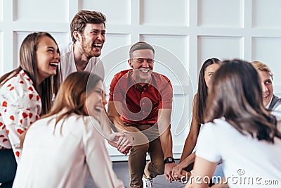 People hold hands, play and have fun. Stock Photo