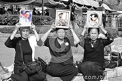 The people hold the portrait of King Bhumibol Adulyadej at Sanam Luang Editorial Stock Photo