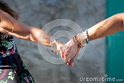 PEOPLE HOLDIN HANDS WITH LOVE Stock Photo