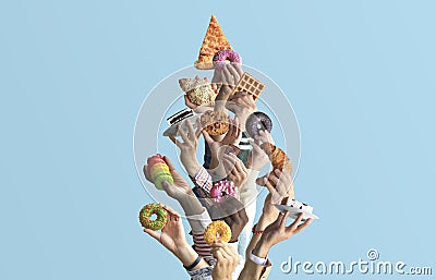 People are holding different desserts in their hands. Stock Photo