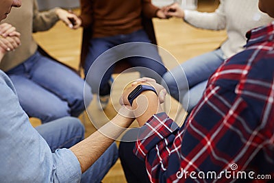People Holding Hands in Support Group Stock Photo
