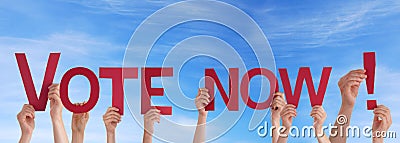People Holding Vote Now in the Sky Stock Photo
