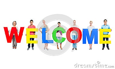 People Holding The Word Welcome Stock Photo