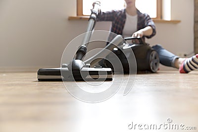 People, housework and housekeeping concept - happy woman with vacuum cleaner at home. Spring cleaning Stock Photo