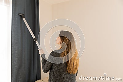 People, housework and housekeeping concept - woman with vacuum c Stock Photo