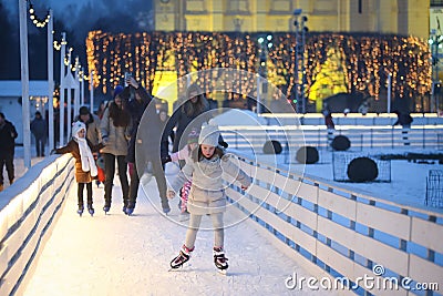 People ice skating at evening Editorial Stock Photo