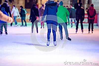 People ice skating at night in Vienna, Austria. Winter. Stock Photo