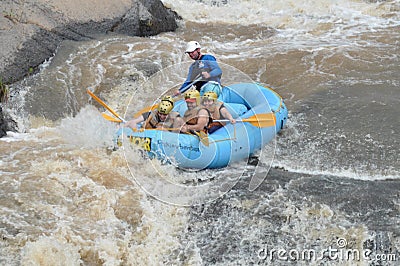 People inside a rafting boat going down Fish river in Socorro city, Brazil. Editorial Stock Photo