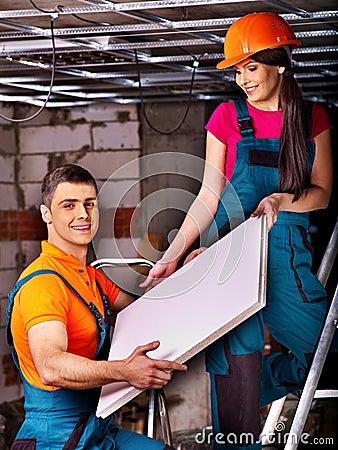 People installing suspended ceiling Stock Photo