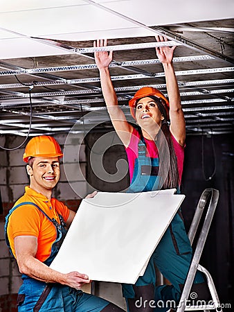 People installing suspended ceiling Stock Photo