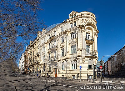 people at Kaiser Friedrich Ring - engl: King Friedrich circle - with its old scenic facade of the 19th century in classicistic and Editorial Stock Photo