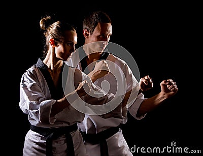 People in kimono make martial arts exercise Stock Photo