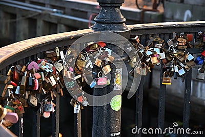 People leae love lock at Nyhcan canal bridge in Copenhagen Editorial Stock Photo