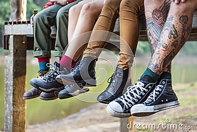 People legs hanging outdoors concept Editorial Stock Photo