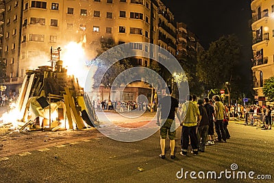 People lighting a bonfire, Barcelona Editorial Stock Photo