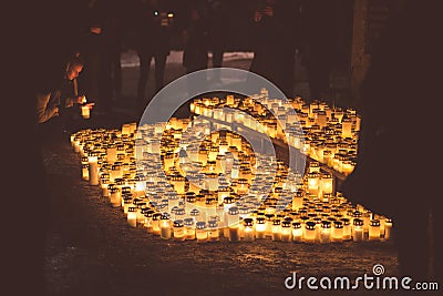 People lighting candles in the Kalevankangas cemetery in Tampere Editorial Stock Photo