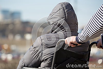 People with limited mobility take a walk by wheelchair Stock Photo