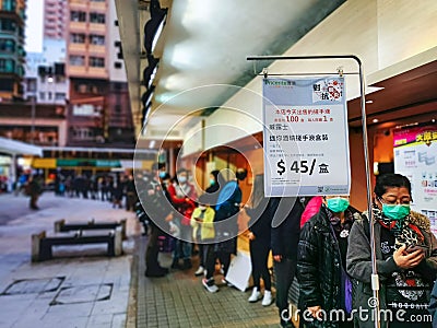 People line up to buy alcohol-based handrub: Walch, 7 Pieces per box, HK$45 per box Editorial Stock Photo