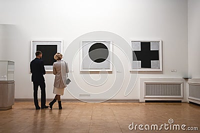 People look at Black Square painting, Kazimir Malevich arts on display at The State Russian Museum, St.Petersburg Editorial Stock Photo