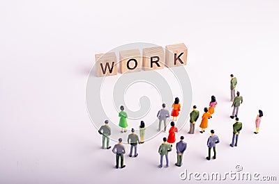 People are looking at a standing four wooden cube with letters Stock Photo