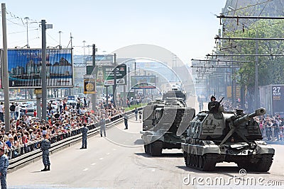 People looks on weaponry and tank on road Editorial Stock Photo