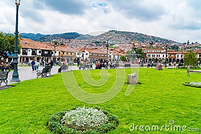 People at the Main Square Plaza de Armas with the Statue of Pachacuti and cityscape of Cusco in Peru Editorial Stock Photo