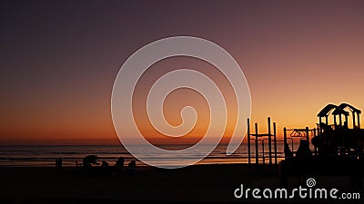 People making bbq campfire. Beachfront recreation area for barbeque with fire place. California USA Editorial Stock Photo