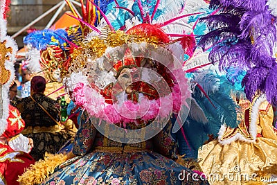 Annual Mardi Gras Fat Tuesday grand parade on maltese street of allegorical floats and masquerader procession Editorial Stock Photo