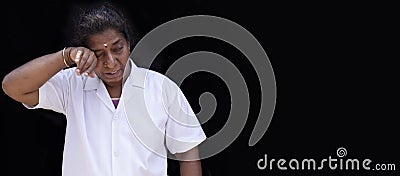 People, medicine, healthcare and sorrow concept - sad or crying female doctor or nurse at black background Stock Photo