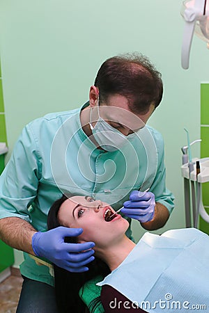 People, medicine, stomatology and health care concept - close up of dentists and assistant with mirror Stock Photo