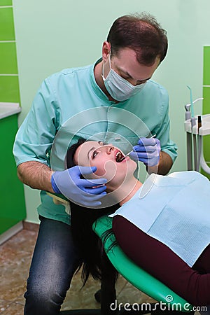 People, medicine, stomatology and health care concept - close up of dentists and assistant with mirror Stock Photo