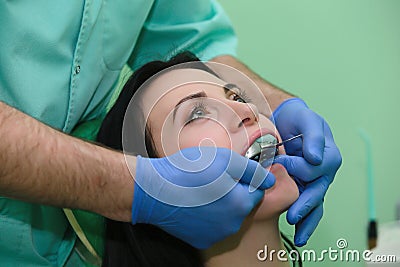 People, medicine, stomatology and health care concept - close up of dentists and assistant with mirror Stock Photo