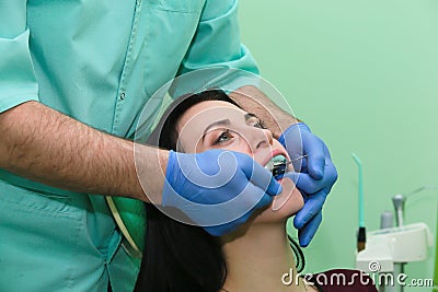 People, medicine, stomatology and health care concept - close up of dentists and assistant with mirror Stock Photo