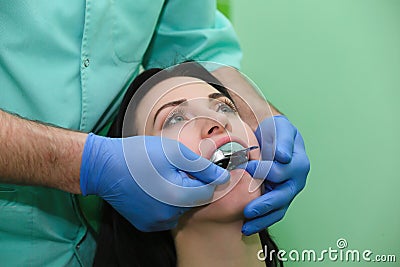 People, medicine, stomatology and health care concept - close up of dentists and assistant with mirror Stock Photo