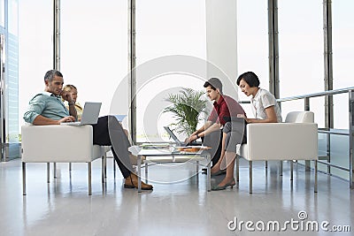 People At Modern Waiting Room In Office Stock Photo