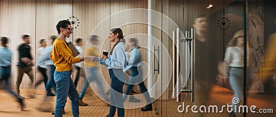 People at motion blur. Concept of working at action. Group of coworkers at open space. Wide image Stock Photo