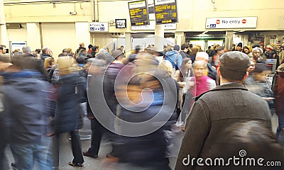 People in motion at London Underground station, rush hour photo. United Kingdom Editorial Stock Photo