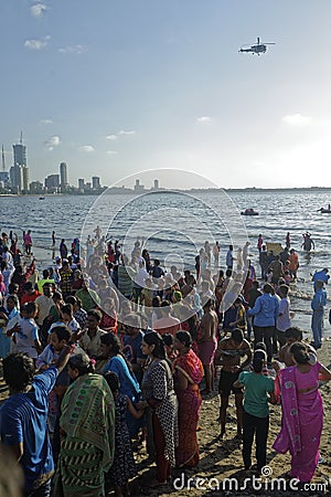 People observe Ganpati immersion process during Ganpati festival Editorial Stock Photo