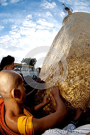 People offerings of gold for Kyaiktiyo Pagoda.Myanmar. Editorial Stock Photo