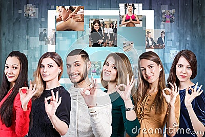 People with OK sign and digital tablet Stock Photo