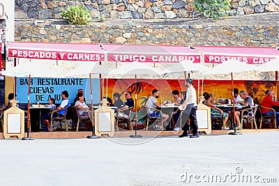 People outdoor Mediterranean restaurant terrace, Ajuy, Fuerteventura Editorial Stock Photo