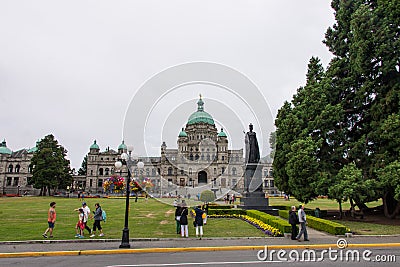 People outside the British Columbia Parliament Building in Victoria, Canada Editorial Stock Photo