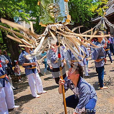 People parade through a street to Nezu-jinja shrine in Bunkyo Azalea Festival in Tokyo, japan Editorial Stock Photo