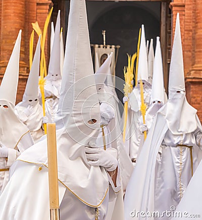 People participating in the Holy Week procession in a Spanish city during Easter Editorial Stock Photo